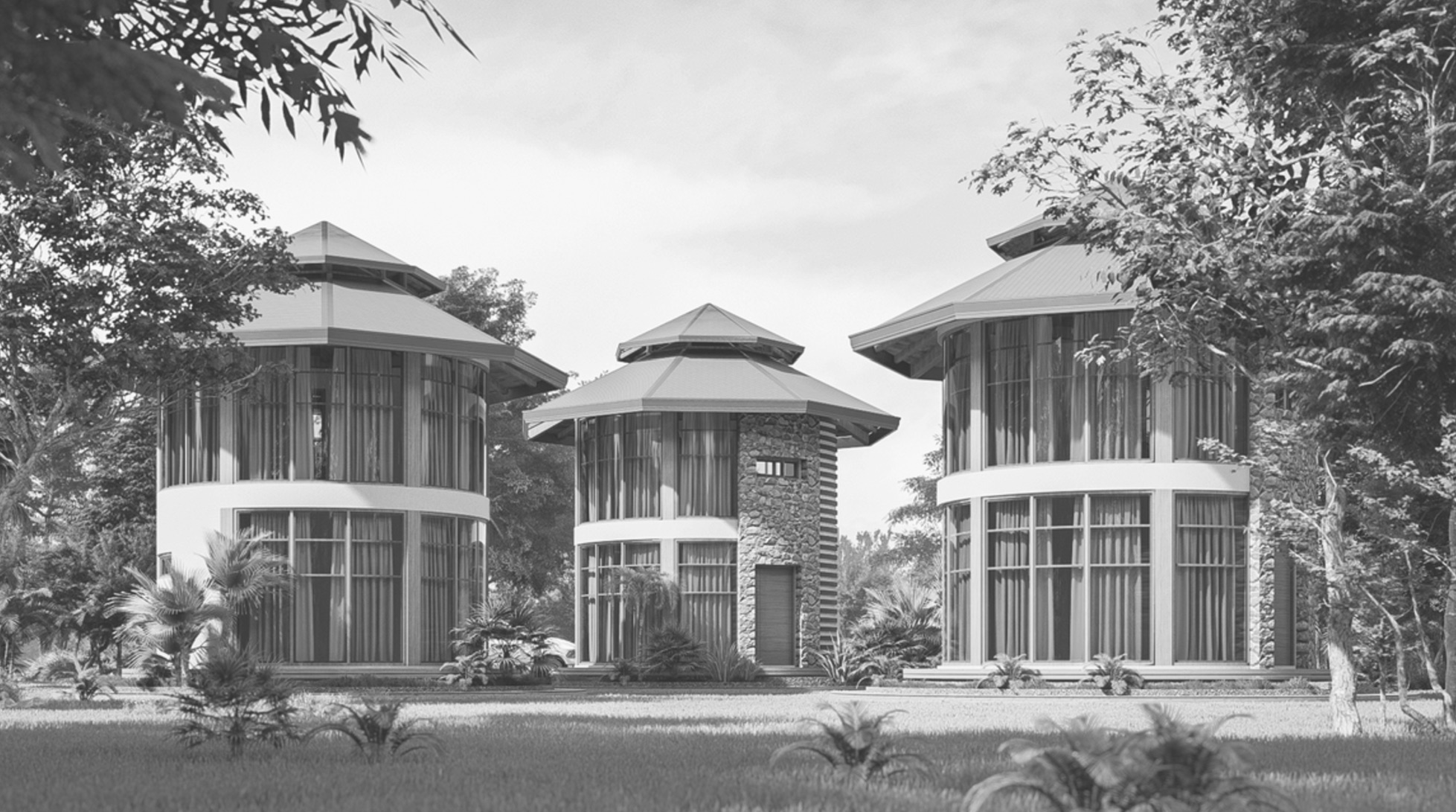 Monochrome view of three round cabins among trees