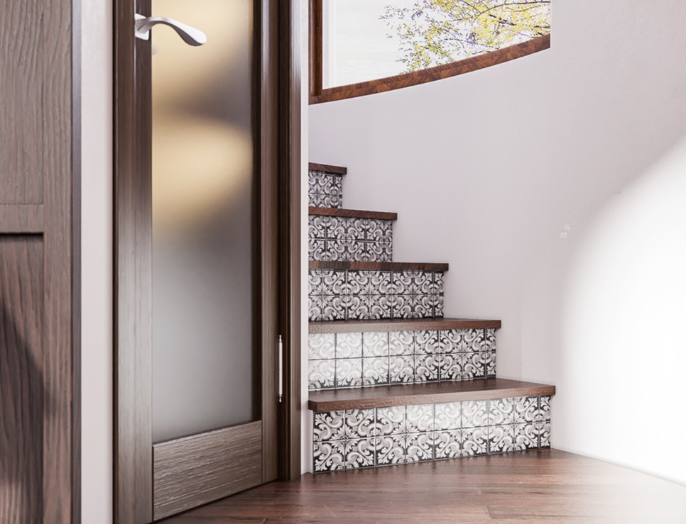 Curved stair with patterned tile risers beside a frosted glass door